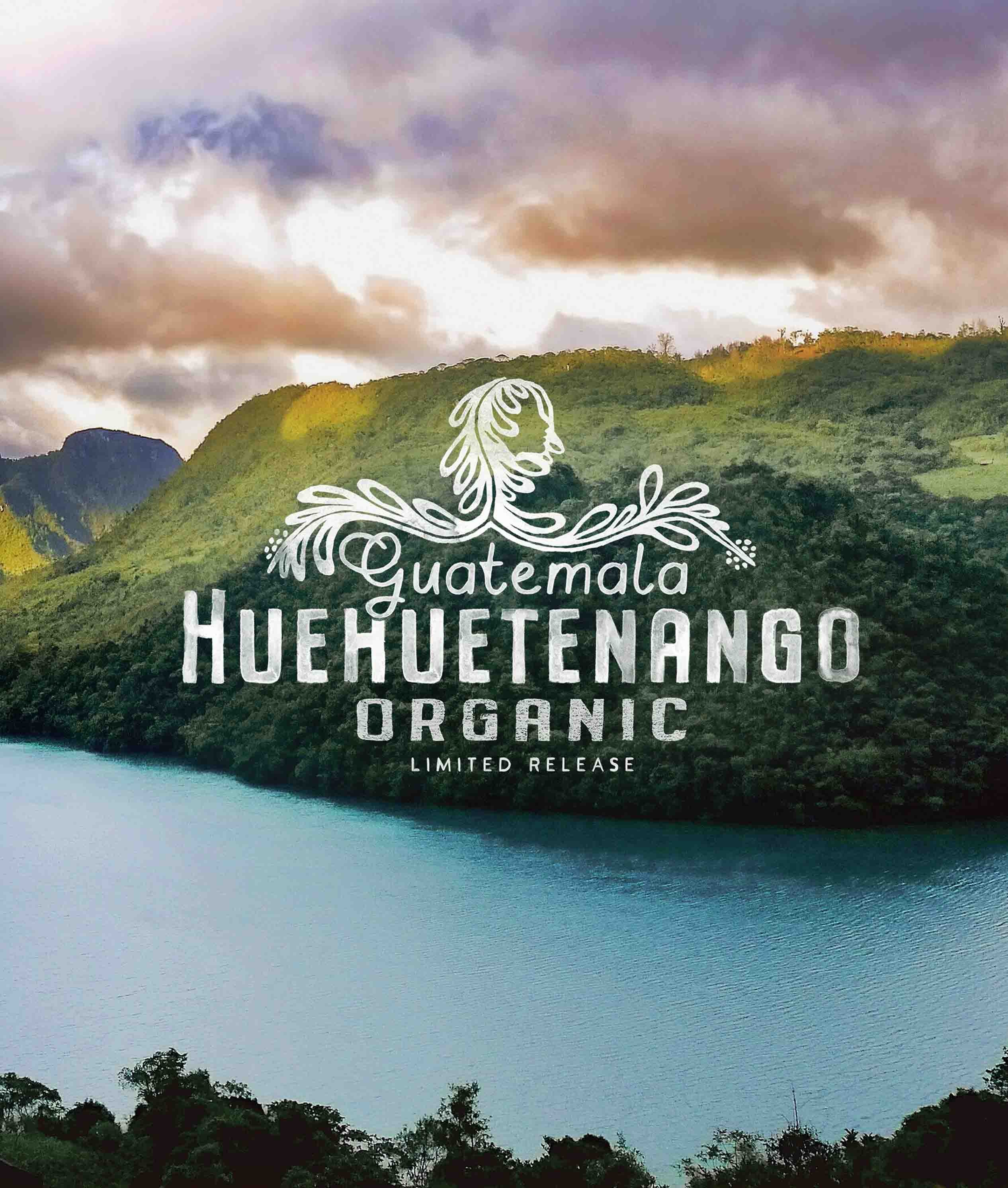 Huehuetenango Organic logo with a scenic background of a lake and mountains.